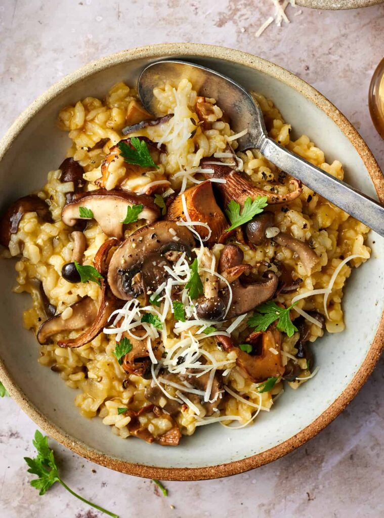 Shiitake Mushroom Risotto with Parmesan and Thyme plated on a white plate