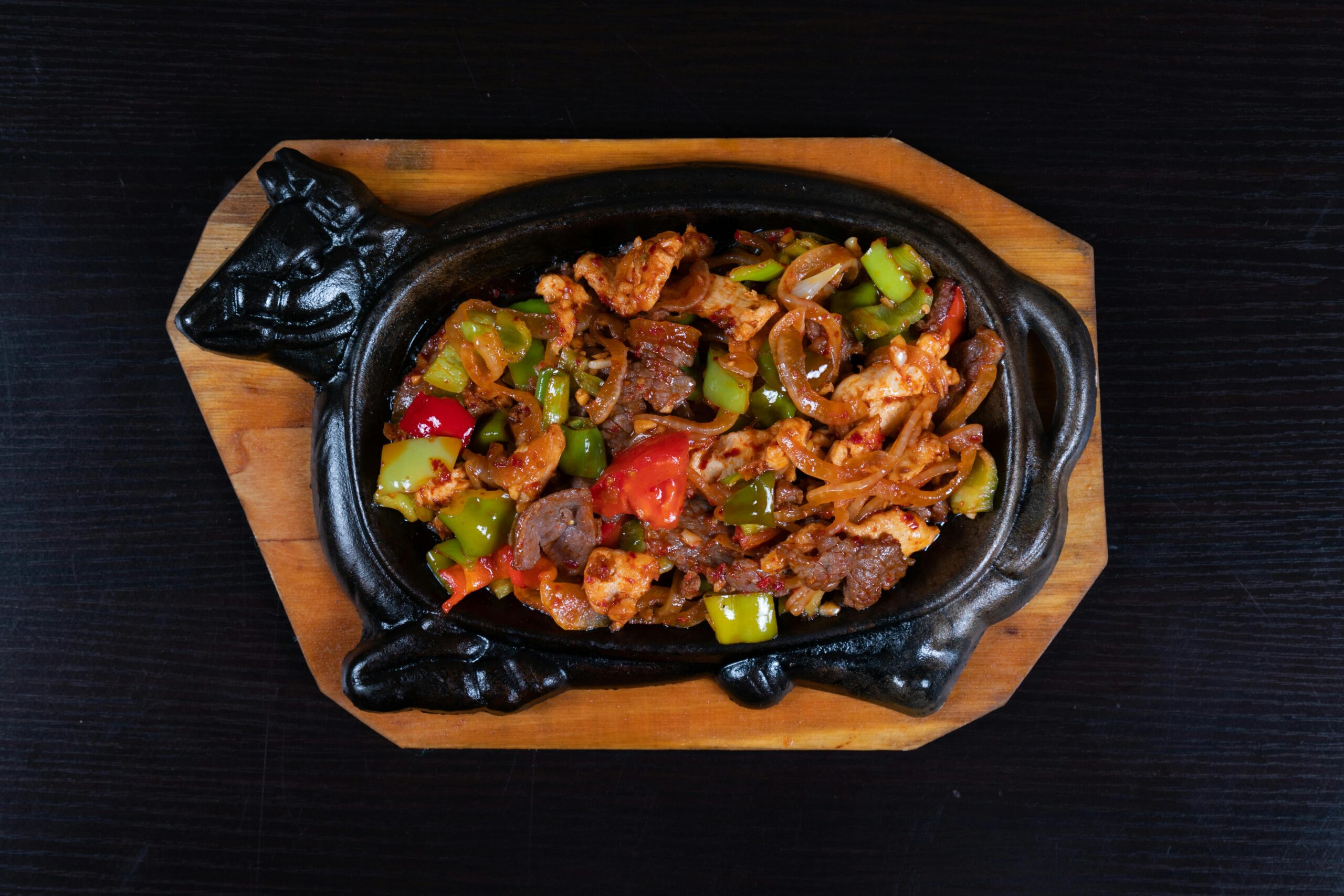 Beef and Shiitake Mushroom Stir Fry with flavorful beef and vegetable served hot on a unique cast iron skillet, perfect for dinner.